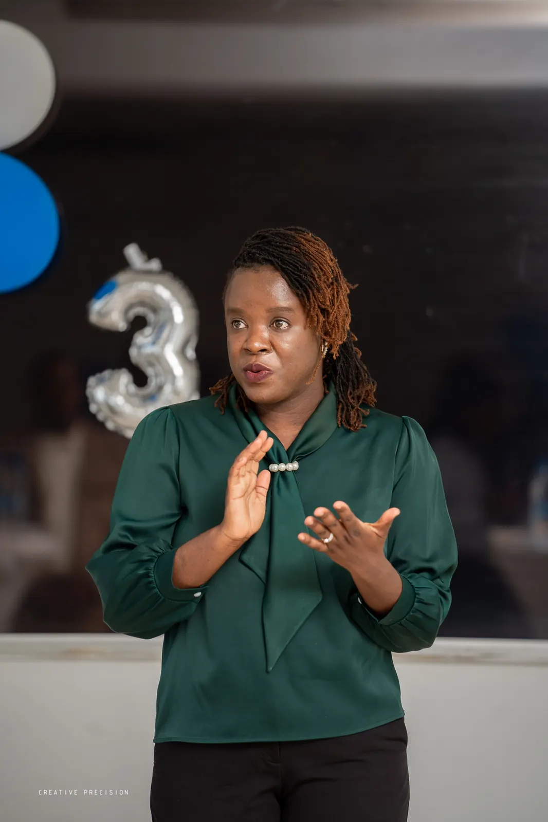 A Symmetric colleague presenting at the third-anniversary celebration